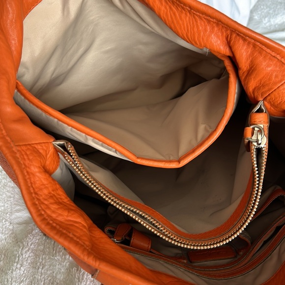 Large leather Cole Haan orange shoulder bag with silver hardware buckles. - Picture 15 of 16